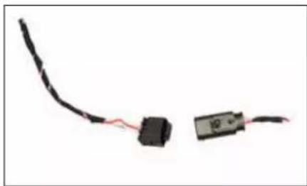 Two electronic components with wires, one black and one red, against a white background (no text or symbols visible)