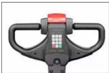 Close-up of a black manual push-button balance with control buttons and handle (no visible text or symbols)