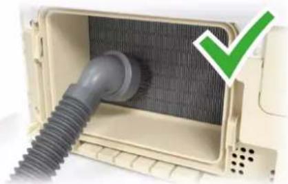 Interior view of a portable air conditioner unit with a coiled hose and ventilation grille (no text or symbols visible)