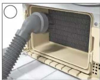 Close-up of a mechanical component with a coiled pipe inserted into a textured internal chamber (no visible text or symbols)