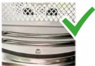 Close-up of a metallic surface with a green checkmark overlay (no text or symbols)