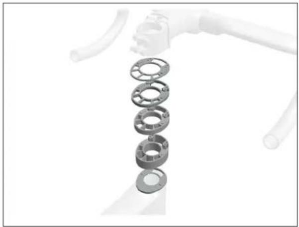 Exploded view of a mechanical assembly with multiple flanged components (no text or symbols visible)