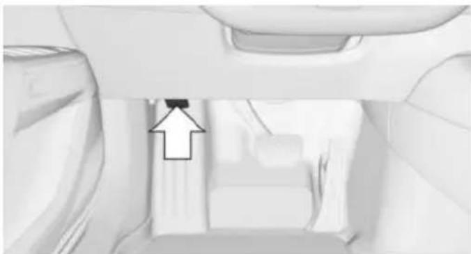 Interior view of a vehicle showing a car interior with a highlighted upward arrow (no text or symbols)