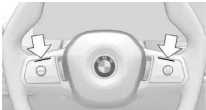 Top-down view of a car steering wheel with BMW logo and directional arrows indicating motion (no text or symbols)