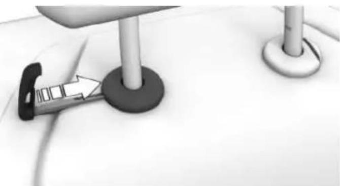 Close-up of a car seatbelt buckle being inserted into a seat, with no visible text or symbols