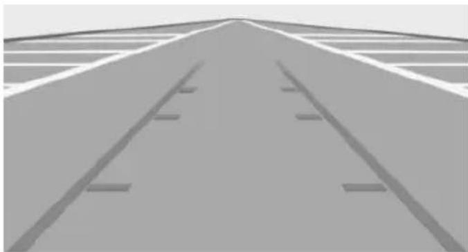Grayscale view of a plain road with parallel tracks and lane markings (no text or symbols)