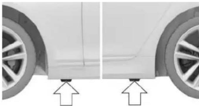 Side view of a car showing front and side structural details with arrows pointing to the lower side (no text or symbols present)