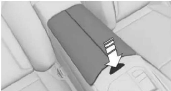 Interior view of a car seatbelt with a white arrow pointing to the seat area (no text or symbols visible)