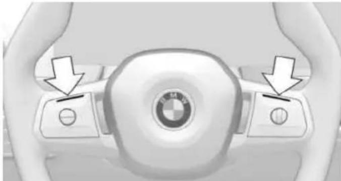 Top-down view of a BMW car steering wheel with directional buttons and a central logo (no text or symbols visible)