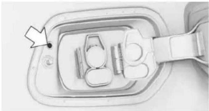Top-down view of a medical device with a tool inserted into a housing (no visible text or symbols)