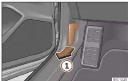 Interior view of a vehicle's dashboard and seat area, showing no visible text or symbols