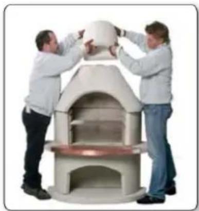 Two people assembling a large white architectural structure with arched windows (no text or symbols visible)