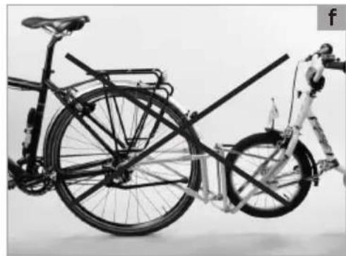 Black-and-white photo of a bicycle with front wheel and rear rack, no visible text or symbols