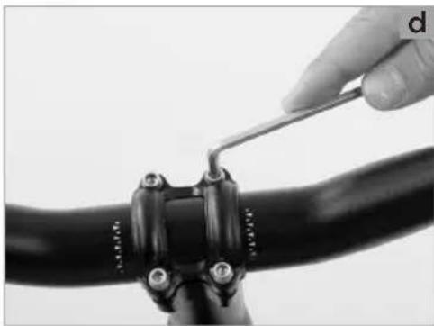 Close-up of a hand using a tool to tie or adjust a black mechanical component (no visible text or symbols)
