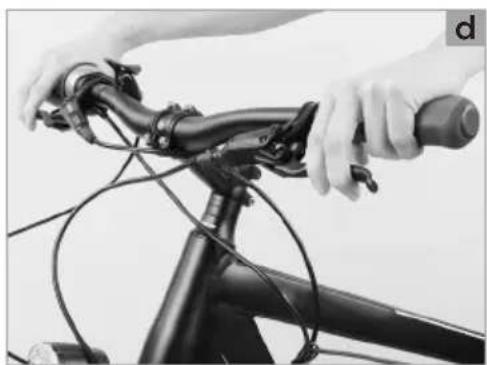 Close-up of hands adjusting a bicycle's steering wheel and lever (no text or symbols visible)