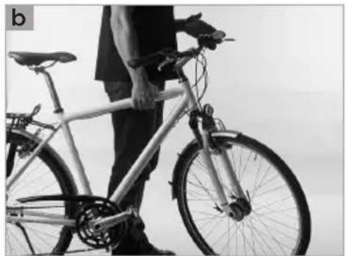 Person standing beside a bicycle, no visible text or symbols