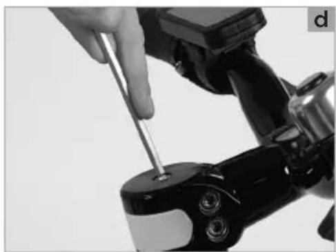 Close-up of a hand using a screwdriver to adjust a mechanical component (no visible text or symbols)