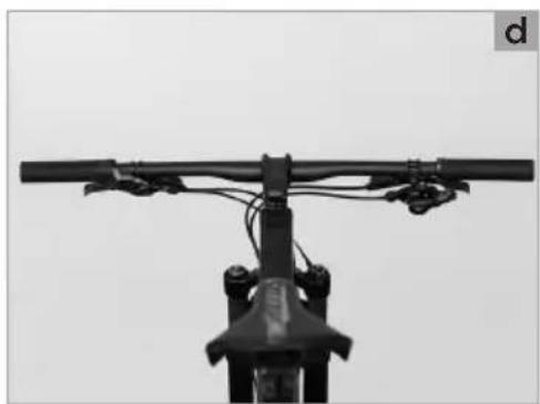 Close-up of a bicycle's front wheel and overhead cable (no text or symbols visible)