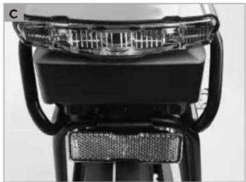 Close-up of a bicycle's front seat and rear bumper with visible mesh and black plastic components (no text or symbols)