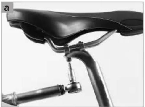 Close-up of a black bicycle wheel and suspension bracket (no text or symbols visible)