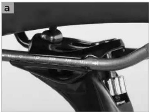 Close-up of a mechanical component with a curved pipe and attached bracket (no visible text or symbols)