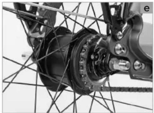 Close-up of a bicycle's front wheel assembly with visible gears and hub structure (no text or symbols)