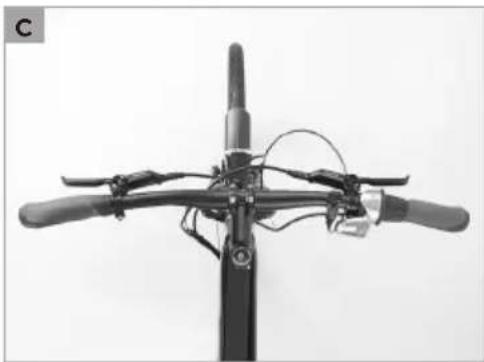 Top-down view of a bicycle's front wheel and overhead cable (no text or symbols visible)