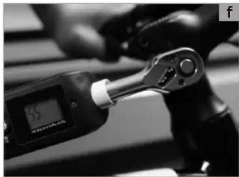 Close-up of a hand using a digital pressure monitor on a mechanical device (no visible text or symbols)
