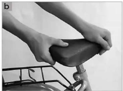 Close-up of hands assembling a bicycle seat component (no text or symbols visible)