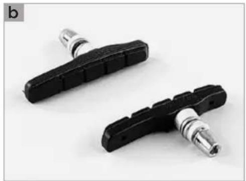 Two black bicycle tire components with metallic fittings, shown against a white background (no text or symbols visible)