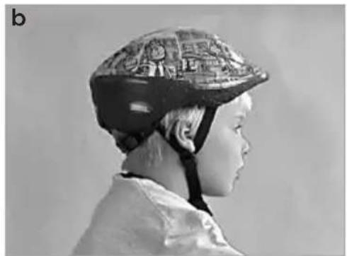 Side profile of a person wearing a patterned helmet (no visible text or symbols)