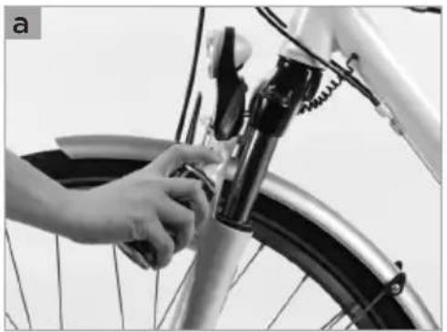 Close-up of a hand adjusting a bicycle wheel component (no visible text or symbols)