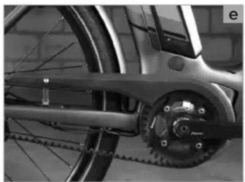 Close-up of a bicycle's front wheel and chain, showing mechanical components and gear mechanism (no text or symbols visible)