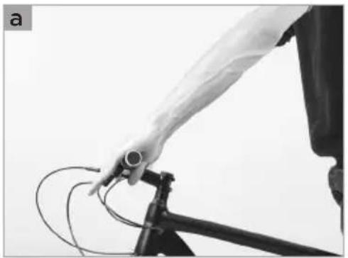 Close-up of a person using a bicycle bike to lift wires (no visible text or symbols)