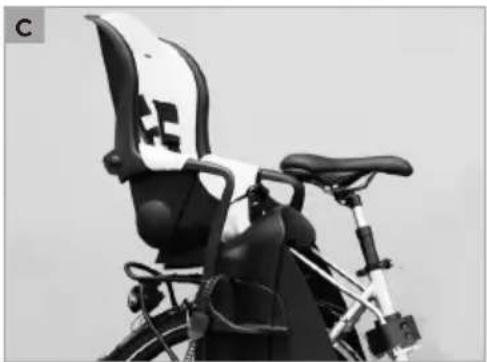 Close-up of a bicycle seat with white and black panels, no visible text or symbols