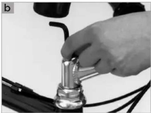 Close-up of a hand adjusting a metallic mechanical component with wires (no visible text or symbols)