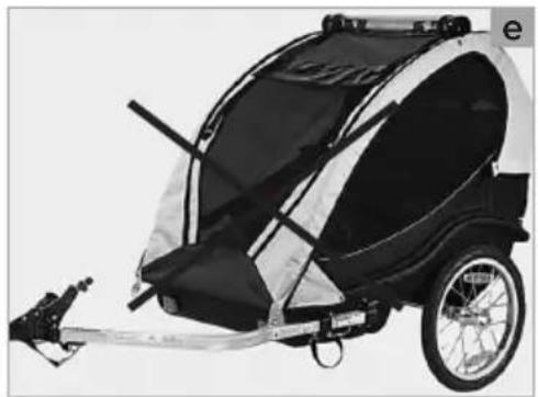 Black and white photo of a two-wheeled dog-drawn cart with a mounted cable, no visible text or symbols.
