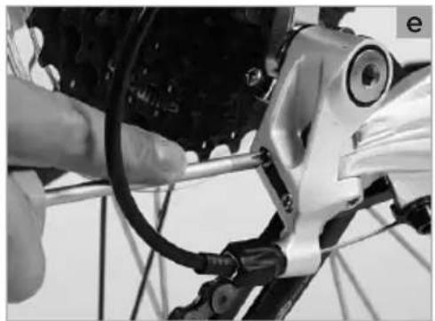 Close-up of a bicycle's head assembly with visible wiring and mechanical components (no text or symbols)