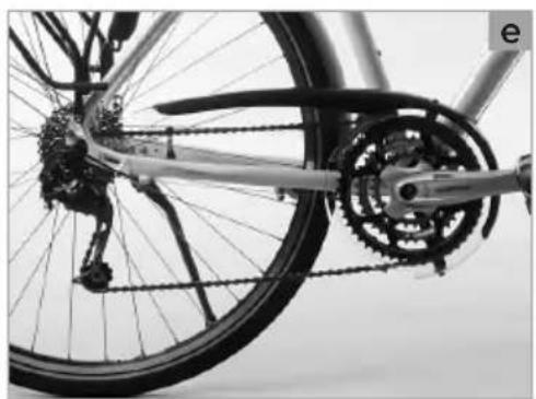 Close-up of a bicycle wheel and chain gear mechanism (no text or symbols visible)