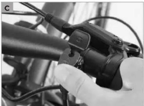 Close-up of a hand holding a bicycle brake lever, no visible text or symbols