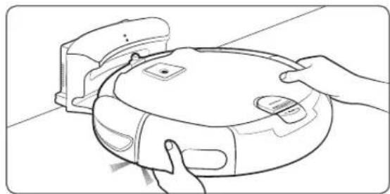 Line drawing of hands holding a robotic vacuum cleaner (no text or symbols)
