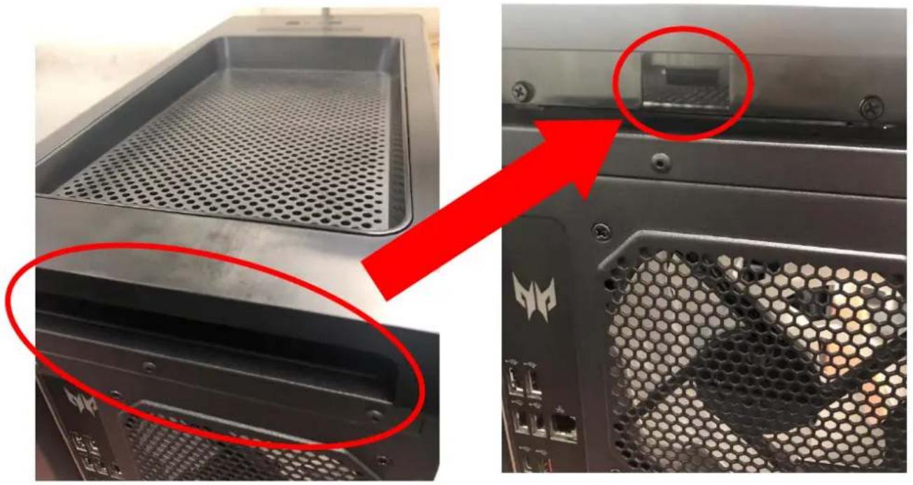 Close-up of a computer tower case with hexagonal ventilation grilles and a highlighted internal component (no text or symbols visible)