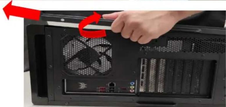 Close-up of a computer tower internal panel with a hand adjusting the fan, showing no text or symbols on the device itself.