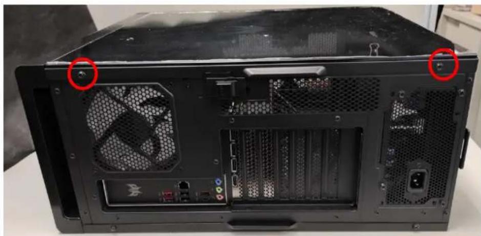 Back view of a black desktop computer tower showing internal fan and drive structure (no text or symbols visible)