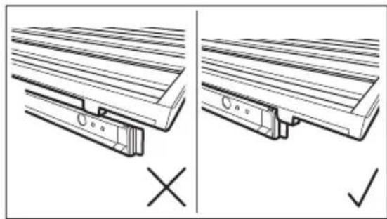 Technical line drawing showing two views of a wooden bracket assembly with mounting holes and a cross mark.