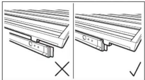 Technical line drawing showing two views of a wooden bracket assembly with mounting holes and a cross mark (no text or symbols).