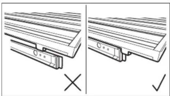 Technical diagram showing two views of a wooden bracket assembly with cross and check symbols (no text or labels)