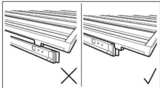 Technical line drawing showing two views of a wooden bracket assembly with mounting holes and a cross mark (no text or symbols).
