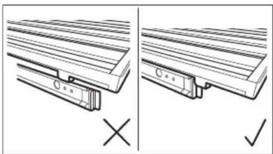 Technical diagram showing two views of a wooden bracket assembly with cross and check symbols (no text or labels)