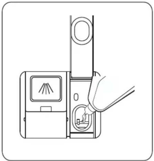Line drawing of a hand inserting a device into a device with a fan and screen (no text or symbols).